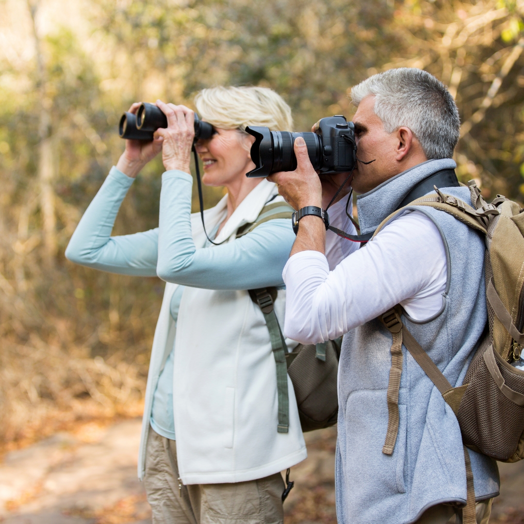 A happy couple birding near Harmony Place in Massachusetts