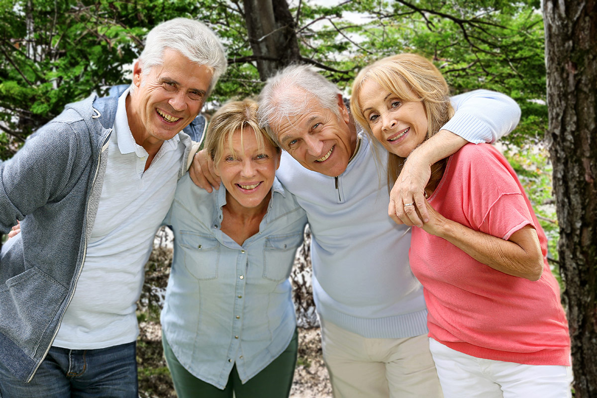 Happy Couples Gathered by trees in Rutland MA
